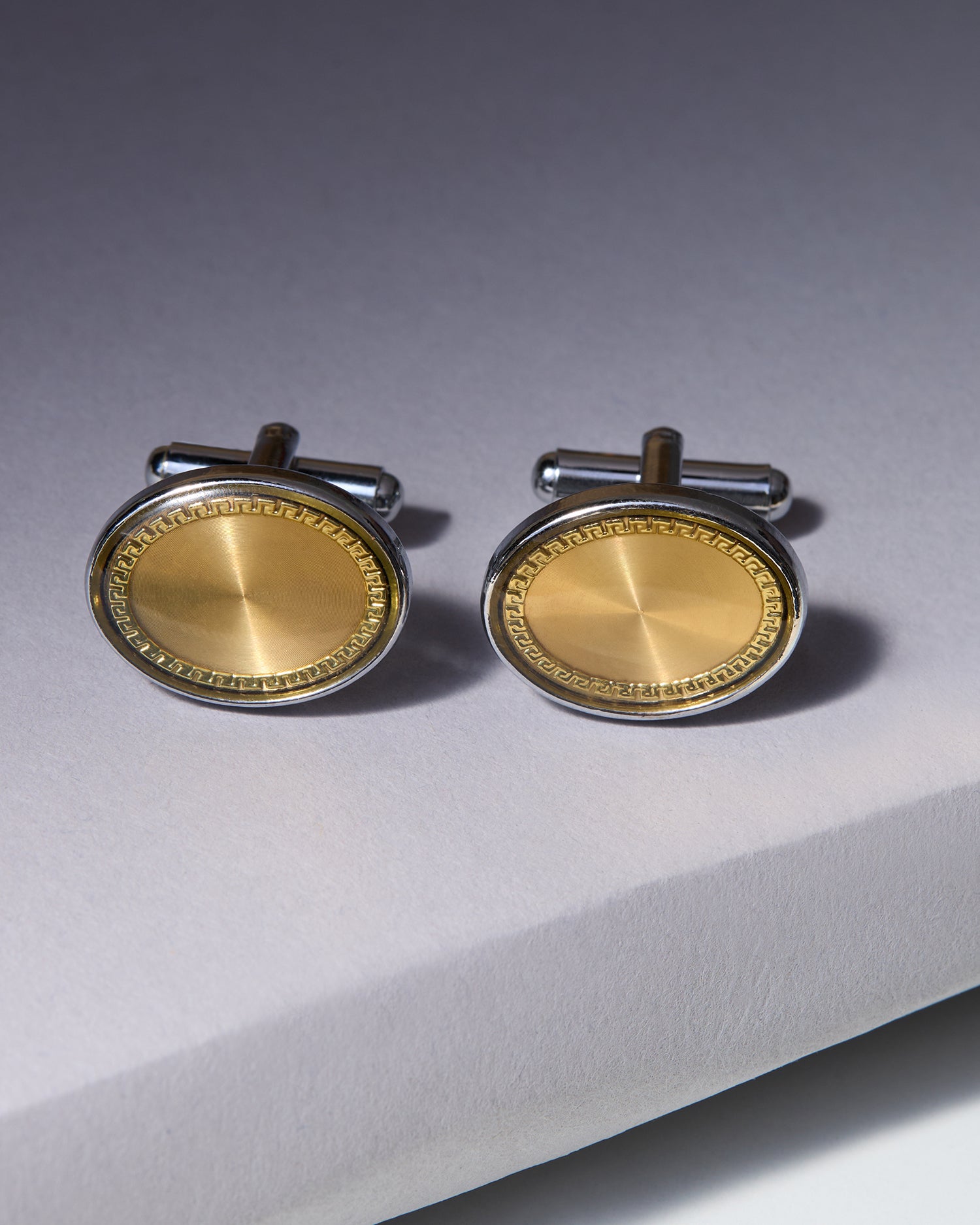 The Aurelian Executive Cufflinks — Brushed Gold & Silver Greek Key
